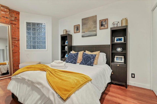 bedroom with wood finished floors