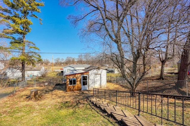 view of yard featuring an outbuilding and a fenced backyard