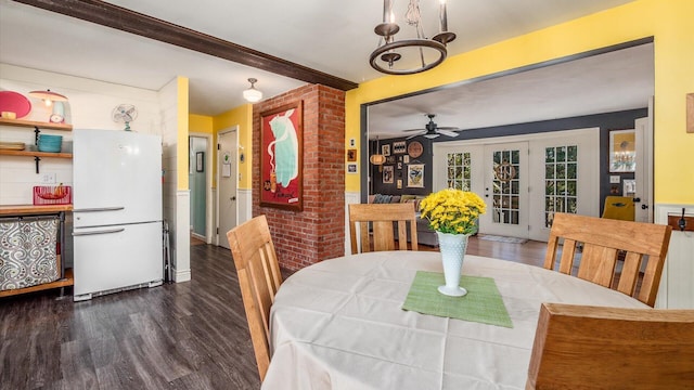 dining room with beam ceiling, dark wood-type flooring, and a ceiling fan