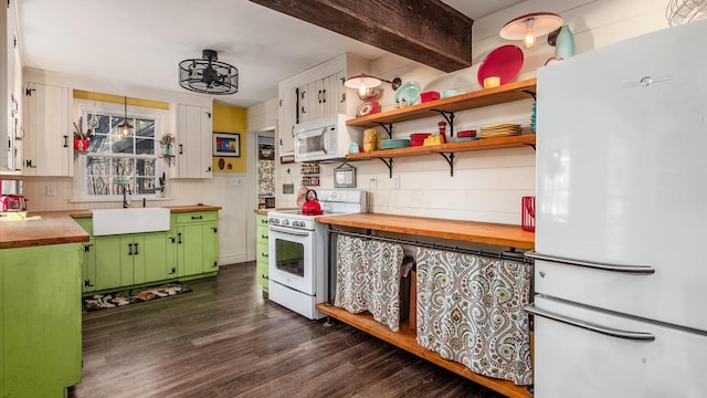 kitchen featuring green cabinets, dark wood-type flooring, butcher block counters, white appliances, and a sink