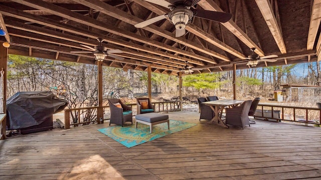 wooden deck featuring area for grilling and outdoor dining area