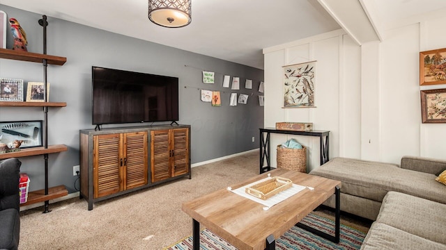 carpeted living room with baseboards