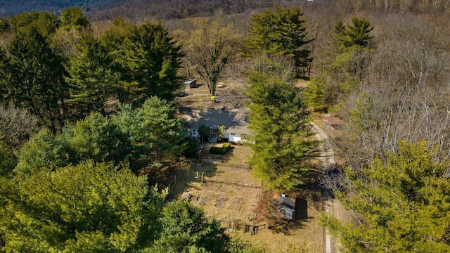 birds eye view of property with a wooded view