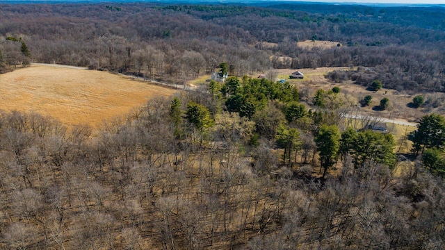 drone / aerial view featuring a rural view and a forest view