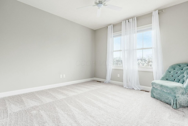 unfurnished room featuring baseboards, carpet floors, and ceiling fan