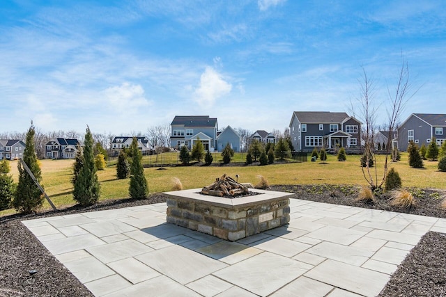 view of patio / terrace with a residential view and an outdoor fire pit