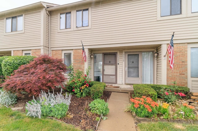 entrance to property with brick siding