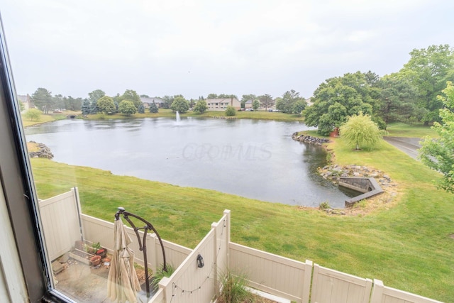 view of water feature with fence