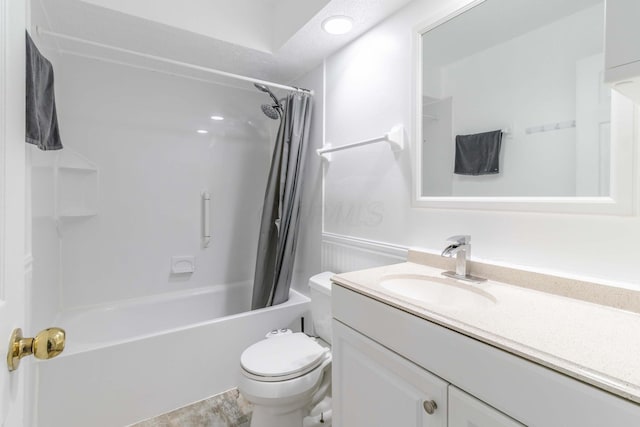 bathroom featuring vanity, toilet, and shower / tub combo