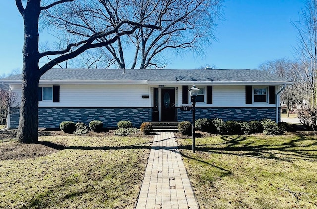 single story home with stone siding and a front lawn