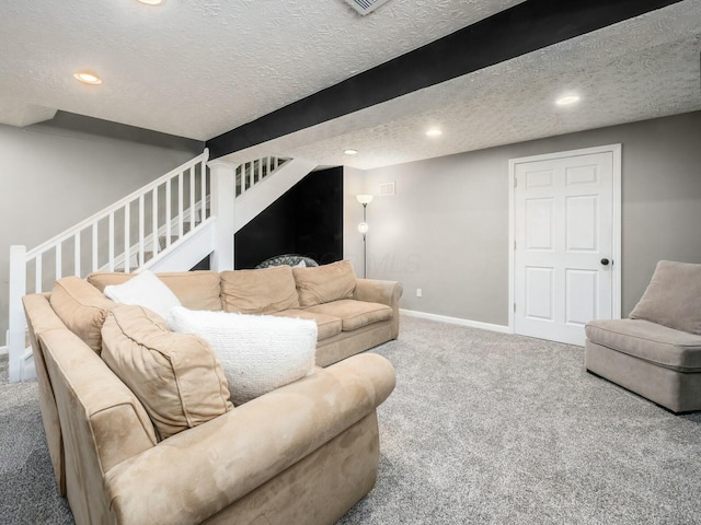 carpeted living area with recessed lighting, baseboards, a textured ceiling, and stairs