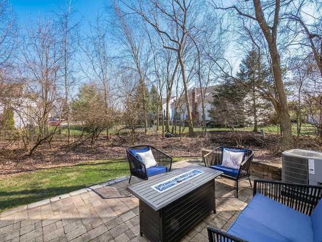 view of patio featuring a fire pit and central AC