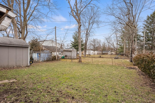 336 E Plum St, Westerville, OH 43081 - view of yard with an outdoor structure, a storage unit, and fence