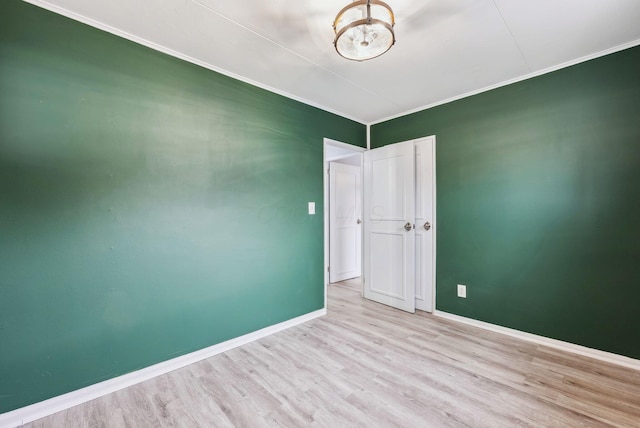 336 E Plum St, Westerville, OH 43081 - empty room with wood finished floors, baseboards, and ornamental molding