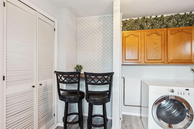 336 E Plum St, Westerville, OH 43081 - clothes washing area featuring washer / clothes dryer, wood finished floors, and wallpapered walls