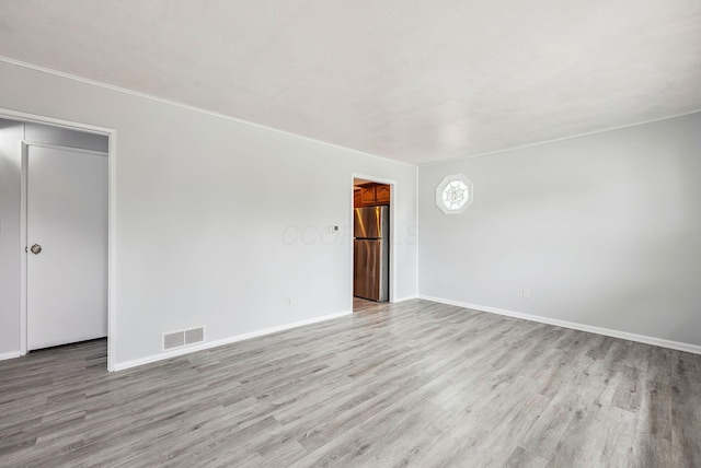 336 E Plum St, Westerville, OH 43081 - empty room with light wood-type flooring, visible vents, and baseboards