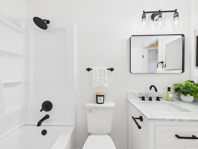 bathroom with toilet, vanity, and bathtub / shower combination