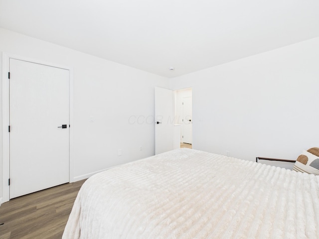 bedroom featuring wood finished floors