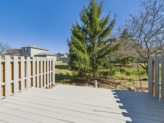 wooden terrace featuring fence