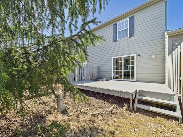 back of property with a wooden deck