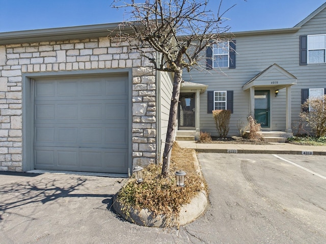 multi unit property featuring stone siding