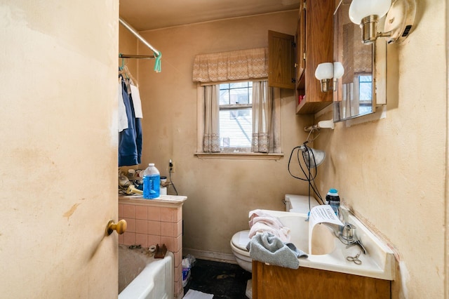 bathroom with a washtub, toilet, vanity, and walk in shower