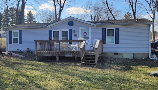 back of house featuring a deck, a yard, and crawl space