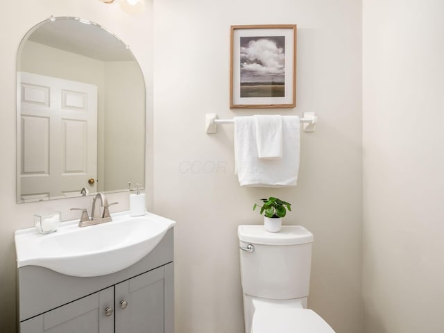 bathroom with toilet and vanity