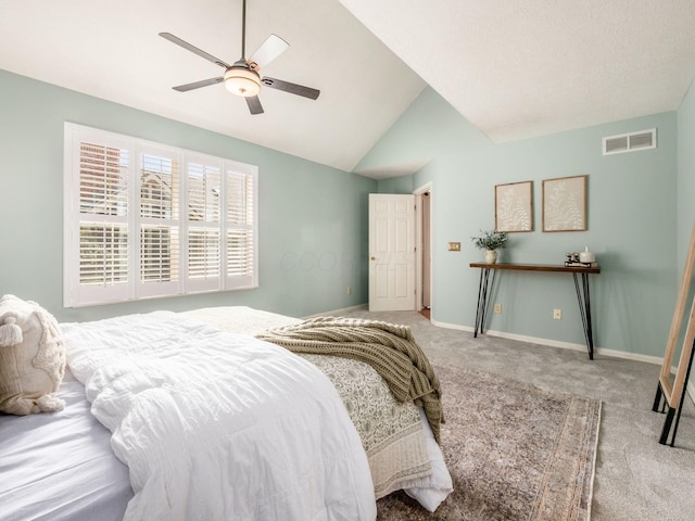 bedroom with a ceiling fan, baseboards, visible vents, carpet floors, and vaulted ceiling