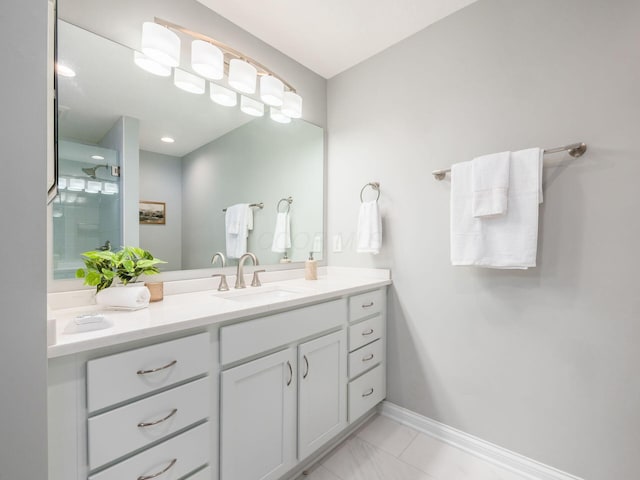 full bathroom featuring vanity and baseboards