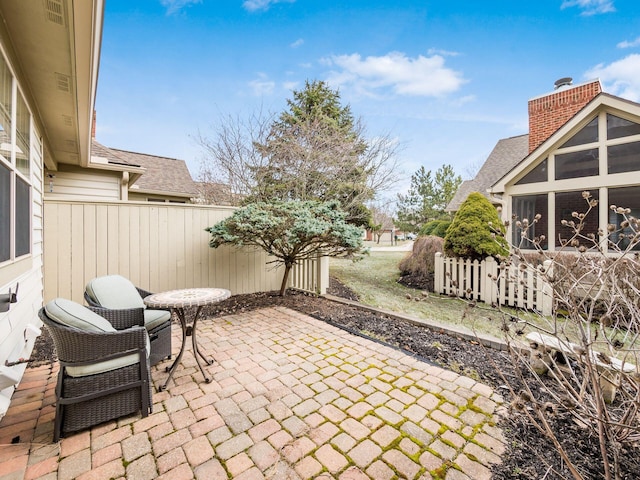 view of patio / terrace featuring fence