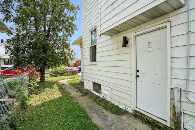 property entrance with fence