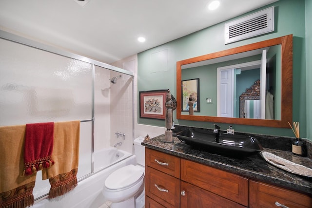 bathroom with visible vents, toilet, recessed lighting, shower / bath combination with glass door, and vanity