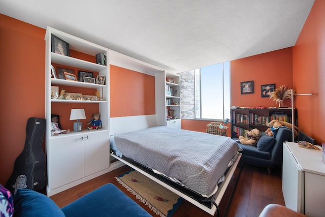 bedroom with wood finished floors