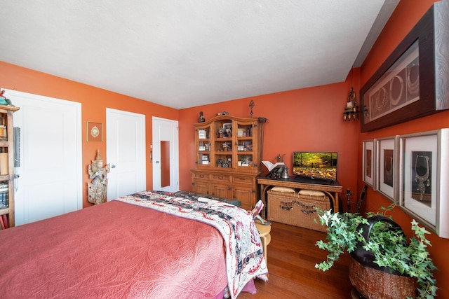 bedroom with wood finished floors