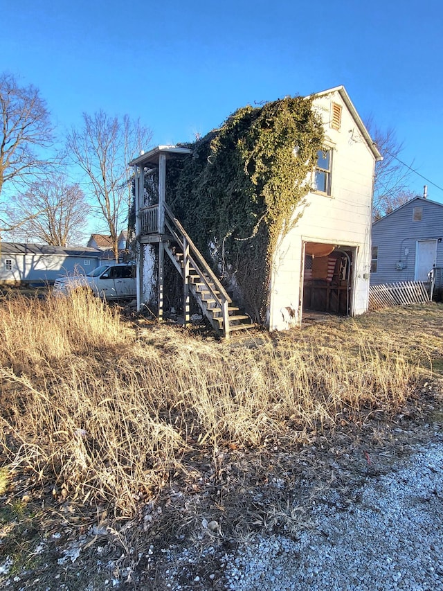 back of property with stairs