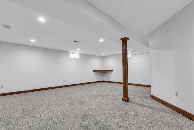 below grade area featuring visible vents, carpet flooring, recessed lighting, and baseboards