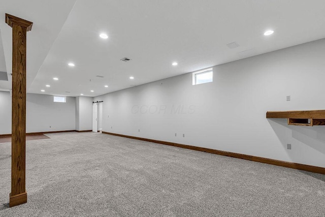 basement with recessed lighting, carpet, visible vents, and baseboards