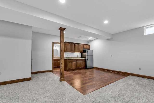 kitchen with baseboards, light countertops, recessed lighting, freestanding refrigerator, and dark wood-style floors