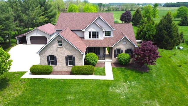 330 Longshore Rd, Sunbury, OH 43074 - view of front of property featuring a front lawn, stone siding, and a garage