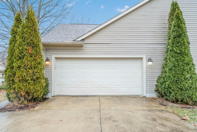 garage with concrete driveway