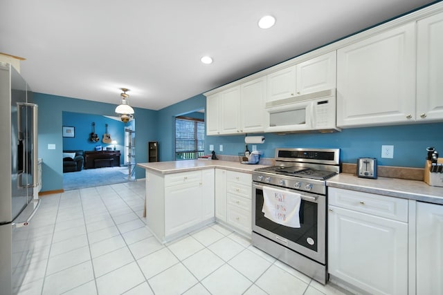 kitchen featuring stainless steel appliances, white cabinetry, a peninsula, and light countertops