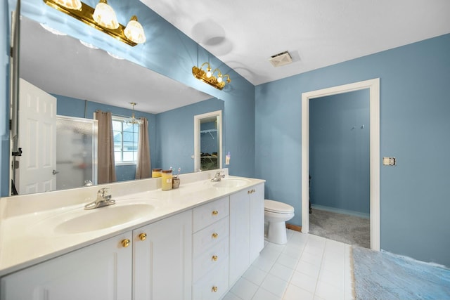 full bathroom with a sink, visible vents, a stall shower, and double vanity