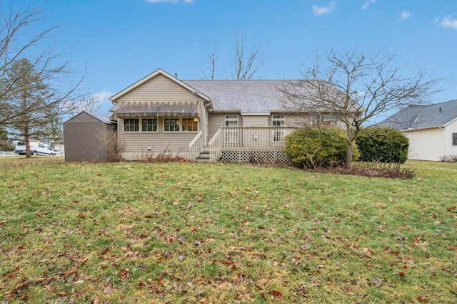 view of front of home featuring a front yard and a wooden deck