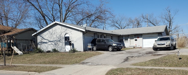 view of home's exterior with aphalt driveway, brick siding, and a garage