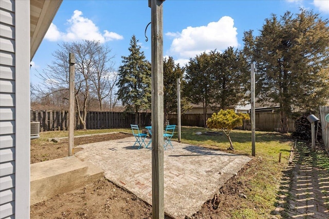 view of yard featuring cooling unit, a patio, and a fenced backyard