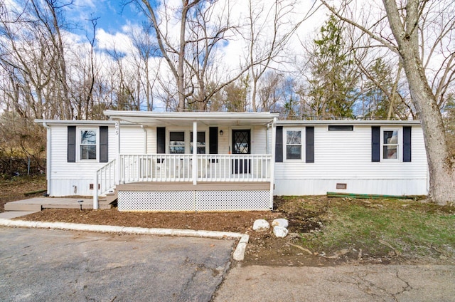 manufactured / mobile home featuring crawl space and a porch