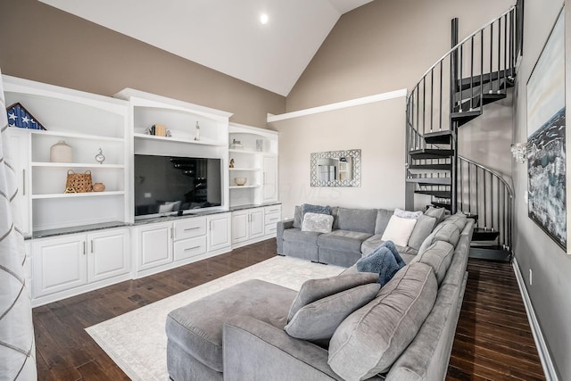 living area featuring stairway, dark wood-style floors, baseboards, and high vaulted ceiling