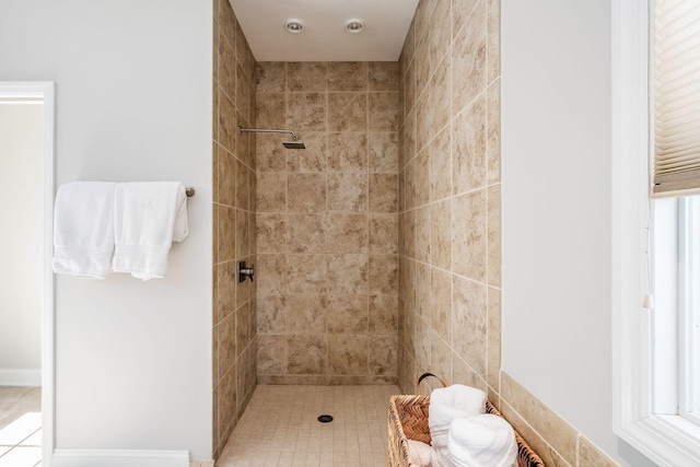 full bathroom featuring a tile shower