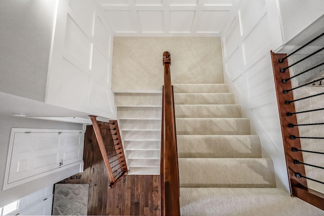 stairs featuring a decorative wall